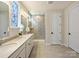 Bright bathroom featuring a double vanity, decorative window, and walk-in shower with glass door at 152 Amerson Dr, Rock Hill, SC 29730