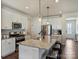 Kitchen features stainless appliances, granite countertops, recessed lighting, island with seating, and wood-look floors at 152 Amerson Dr, Rock Hill, SC 29730