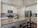 Bright kitchen features granite countertops, stainless appliances, subway tile backsplash, and an island with seating at 152 Amerson Dr, Rock Hill, SC 29730