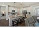 Bright kitchen features white cabinetry, stainless appliances, granite countertops, and a central island with seating at 152 Amerson Dr, Rock Hill, SC 29730