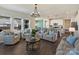 Bright open-concept living room with wood floors and a view into the kitchen and dining area at 152 Amerson Dr, Rock Hill, SC 29730