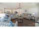 Open-concept living room with wood floors, comfortable seating, and a view into the kitchen at 152 Amerson Dr, Rock Hill, SC 29730