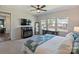 Spacious main bedroom offers a ceiling fan, three windows, neutral decor, and comfortable furnishings at 152 Amerson Dr, Rock Hill, SC 29730