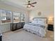 Bright main bedroom with three windows, modern furniture, ceiling fan, and neutral decor at 152 Amerson Dr, Rock Hill, SC 29730
