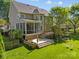 Charming back yard featuring a multi-tiered deck and screened in porch at 17301 Glassfield Dr, Huntersville, NC 28078