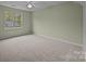 This bedroom features a ceiling fan, and a double window offering great natural light at 17301 Glassfield Dr, Huntersville, NC 28078
