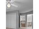 Bedroom with white doors, neutral walls and carpet, and hallway and bathroom access at 17301 Glassfield Dr, Huntersville, NC 28078