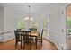 Elegant dining room featuring hardwood floors and natural light at 17301 Glassfield Dr, Huntersville, NC 28078