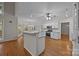 Open kitchen with island, granite countertops, and stainless steel appliances at 17301 Glassfield Dr, Huntersville, NC 28078