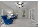 Comfortable living room featuring plush seating, neutral carpeting, and natural lighting at 17301 Glassfield Dr, Huntersville, NC 28078