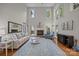 Spacious living room with soaring ceilings, fireplace, and natural light at 17301 Glassfield Dr, Huntersville, NC 28078