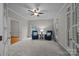 Well-lit living room features neutral walls, carpet, and large windows at 17301 Glassfield Dr, Huntersville, NC 28078