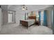 Spacious main bedroom featuring tray ceilings, neutral carpeting, and ample closet space at 17301 Glassfield Dr, Huntersville, NC 28078