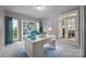 Bright home office features built-in bookshelves and desk at 17301 Glassfield Dr, Huntersville, NC 28078