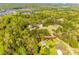 Aerial perspective reveals a home nestled among lush greenery, identified by address marker at 1849 Harris Rd, Fort Mill, SC 29708