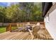 Relax on the wooden back deck with outdoor seating and a barrel table at 1849 Harris Rd, Fort Mill, SC 29708