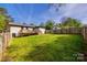 The lush backyard with a wooden fence and back deck at 1849 Harris Rd, Fort Mill, SC 29708