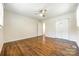 A spacious bedroom features hardwood floors, ceiling fan and closet at 1849 Harris Rd, Fort Mill, SC 29708