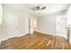 Large bedroom with hardwood floors, ceiling fan, and attached bathroom at 1849 Harris Rd, Fort Mill, SC 29708