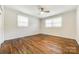 Large bedroom features hardwood floors, ceiling fan, and windows at 1849 Harris Rd, Fort Mill, SC 29708