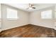 Spacious bedroom features hardwood floors, ceiling fan, and windows at 1849 Harris Rd, Fort Mill, SC 29708
