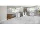 Open kitchen featuring white cabinets, stainless steel appliances, stylish tile, and hardwood floors at 1849 Harris Rd, Fort Mill, SC 29708
