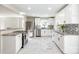 Bright kitchen featuring white cabinets, granite countertops, stainless steel appliances, and tiled floor at 1849 Harris Rd, Fort Mill, SC 29708