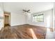 Inviting living room featuring hardwood floors, fresh paint, natural light, and an open doorway at 1849 Harris Rd, Fort Mill, SC 29708