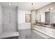 This is a luxury bathroom with double vanity, marble counters, glass shower and modern fixtures at 20114 Norman Colony Rd, Cornelius, NC 28031