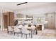 A bright kitchen features an island with counter seating, modern appliances, and ample dining room seating at 20114 Norman Colony Rd, Cornelius, NC 28031