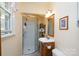 Updated bathroom with a stand-up shower, wood vanity, and modern fixtures at 206 Cliffside Dr, Kannapolis, NC 28081