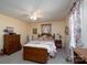 Bedroom with a bed, vintage furniture, and cozy floral patterned curtains for a warm atmosphere at 206 Cliffside Dr, Kannapolis, NC 28081