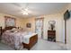 Comfortable bedroom with floral bedding, a ceiling fan, and natural light from the windows at 206 Cliffside Dr, Kannapolis, NC 28081