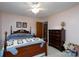 Comfortable bedroom with wood furniture, complemented by a cozy bed and ample natural light at 206 Cliffside Dr, Kannapolis, NC 28081