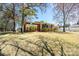 Charming single-story brick home with a well-manicured lawn and mature trees at 206 Cliffside Dr, Kannapolis, NC 28081