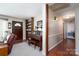Inviting space with a piano, shelves, and a view into the living room and hallway creating a warm and welcoming atmosphere at 206 Cliffside Dr, Kannapolis, NC 28081