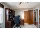 Home office space with a large desk, bookshelves, and natural light at 206 Cliffside Dr, Kannapolis, NC 28081