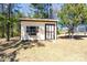 Exterior view of a backyard storage shed featuring a window and door at 206 Cliffside Dr, Kannapolis, NC 28081