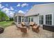 Inviting back patio with a fire pit, comfortable seating, and views of the home's exterior at 2158 Hartwell Ln, Fort Mill, SC 29707