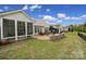 Expansive backyard featuring a patio, landscaped flower beds, and lush green grass at 2158 Hartwell Ln, Fort Mill, SC 29707