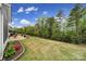 Spacious backyard with a patio, green lawn, and privacy fence, perfect for outdoor activities at 2158 Hartwell Ln, Fort Mill, SC 29707