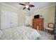 This is a calm bedroom with a dresser, ceiling fan and double closets at 2158 Hartwell Ln, Fort Mill, SC 29707