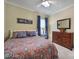 This is a bright bedroom with patterned bedding and two dressers for storage at 2158 Hartwell Ln, Fort Mill, SC 29707