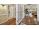 Hallway with hardwood floors that lead to the bathroom and living room at 2158 Hartwell Ln, Fort Mill, SC 29707