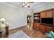 This office space has hardwood floors and custom-built cabinetry plus a view into the living room at 2158 Hartwell Ln, Fort Mill, SC 29707