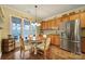 Charming kitchen nook featuring a cozy breakfast table, stainless steel refrigerator, and ample natural light at 2158 Hartwell Ln, Fort Mill, SC 29707