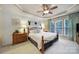 Relaxing main bedroom featuring natural light, tray ceiling, and stylish decor for ultimate comfort at 2158 Hartwell Ln, Fort Mill, SC 29707