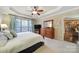 Serene main bedroom featuring a tray ceiling, neutral tones, and access to the main bathroom at 2158 Hartwell Ln, Fort Mill, SC 29707