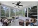 Relaxing sunroom with ample windows, tiled floor, wicker furniture, and serene views at 2158 Hartwell Ln, Fort Mill, SC 29707