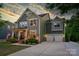 Charming two-story home with attached two-car garage, landscaped front yard, and inviting front porch at 2220 Gallberry Ln, Waxhaw, NC 28173
